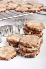 stack of star-shaped homemade christmas cookies with cookie-form