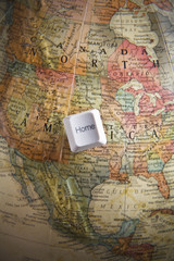 Home key on an earth globe