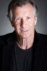 Handsome Senior Man against a Grey Background