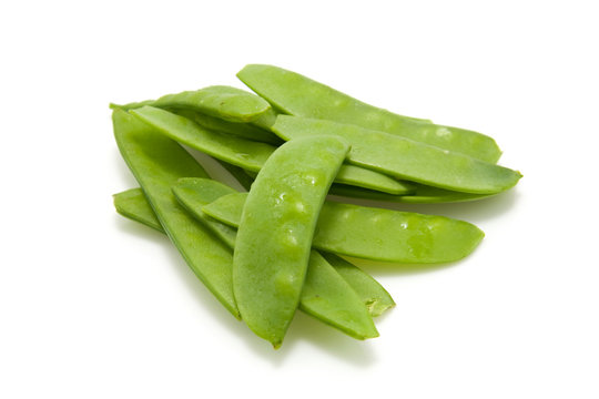 Fresh Chinese pods over white background