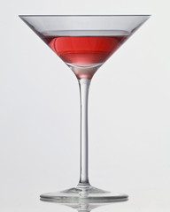 red drink in cocktail glass