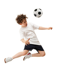 Fototapeta premium Boy playing football isolated on white background