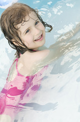 Happy girl playing in water