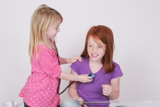 sisters playing doctor