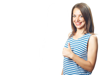 Fototapeta premium Young pretty smiling woman with thumb up