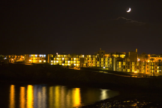 Night view of a beach with reflexes in the sea Lanzarote