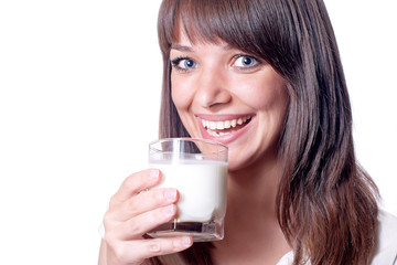 Beautiful woman with drinking milk from glass