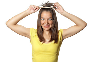 Fototapeta premium Beautiful brunette woman with hairbrush