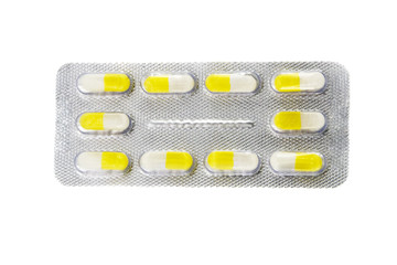 Many different color tablets and pills isolated over white
