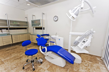 Modern dentist's chair in a medical room.
