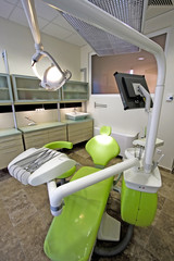 Modern dentist's chair in a medical room.