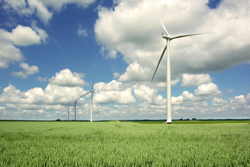 Wind generator on a background of the blue sky.