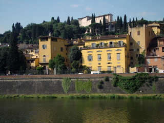 Arno river with Bardini Villa on hill surrounded by cypresses