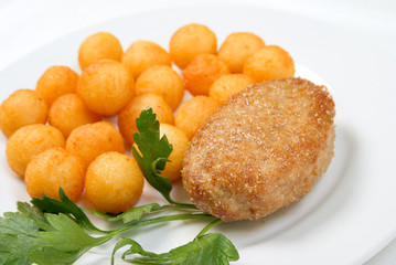 chops with potatoes on plate