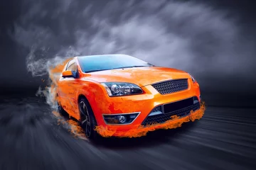 Poster Beautiful orange sport car in fire © Andrii IURLOV