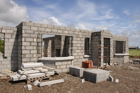 new build concrete stone House Construction blue sky