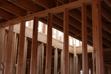 The wood framing of the interior of a new housing project..