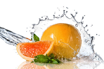 Water splash on orange with mint isolated on white