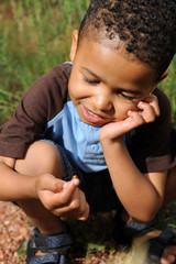 Child playing with ladybug