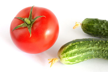 Still life with tomato and cucumbers
