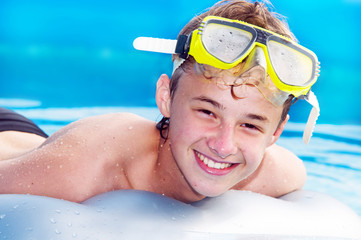 Happy boy in a pool