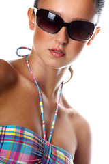 high key fashion portrait of a young woman with a bikini