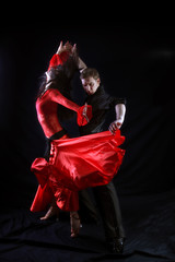 dancers against black background