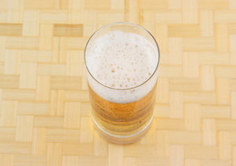 Fresh beer on wooden background
