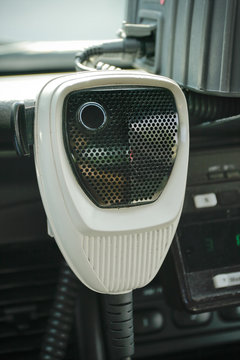 Police car radio mic inside car.