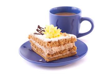Cake and cup isolated on white