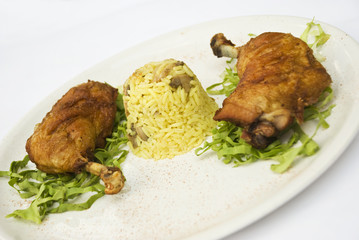 Chicken legs with rice garnish