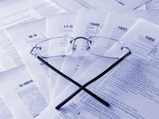 Taxes forms and glasses