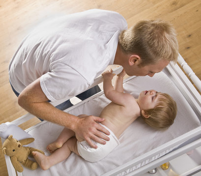 Man Changing Baby