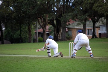 A batsman plays the sweep shot