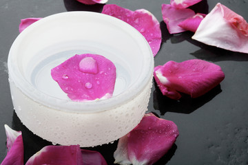 Pink flower petal and water bowl decoration.