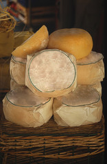 A stack of artisan pecrorino cheeses at the Florence market