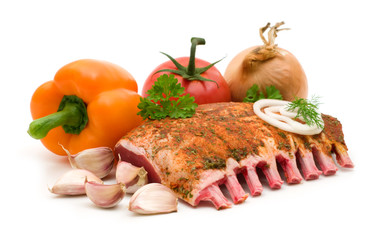 ribs and vegetables on white background..