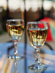 wineglasses in street cafe