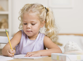 Girl Writing in a Notebook