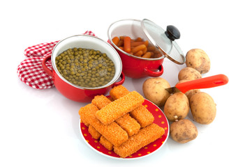 red pans with vegetables