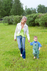Obraz premium younger ma with son on walk