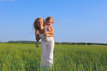 Fototapeta premium Happiness mum playing with a daughter