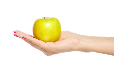 human hand holding yellow apple