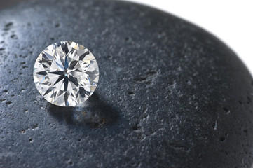 Close up of a diamond on the black stone