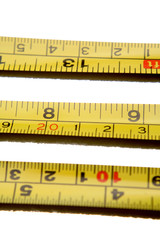 Tape measures on white background