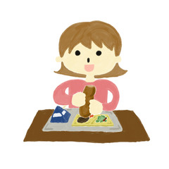 給食を食べる女の子