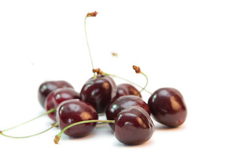group of red cherries isolated on white
