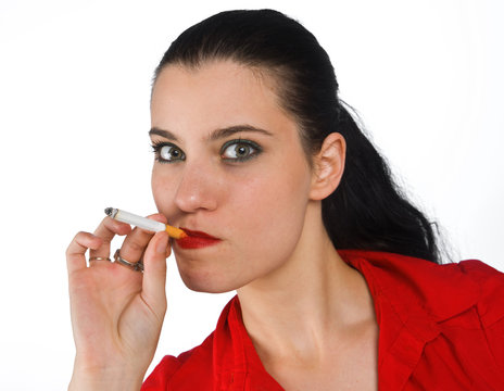 woman in red holding cigarette