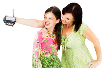 Smiling woman filming with home video camera