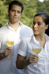 Young couple with glas of wine